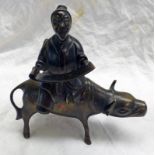 19TH CENTURY CHINESE BRONZE FIGURE OF A PRIEST SAT ON AN OXEN READING A SCRIPT - 15CM TALL