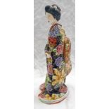 JAPANESE POTTERY FIGURE OF A WOMAN,