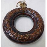 19TH CENTURY TREACLE GLAZED RING SHAPED FLASK DECORATED WITH FLOWERS - 19.