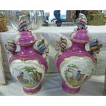 PAIR OF LIDDED DRESDEN PORCELAIN PINK VASES WITH PANELS OF MEN ON HORSEBACK,