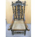 19TH CENTURY CAROLEAN CARVED OAK OPEN ARMCHAIR