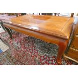 ORIENTAL HARDWOOD RECTANGULAR LOW TABLE ON SHAPED SUPPORTS