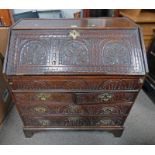 LATE 18TH / EARLY 19TH CENTURY CARVED OAK BUREAU WITH FALL FRONT OVER 2 SHORT & 2 LONG DRAWERS 101