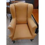 MAHOGANY WINGBACK ARMCHAIR ON SHAPED SUPPORTS