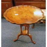 LATE 20TH CENTURY WALNUT CIRCULAR TABLE ON SHAPED SUPPORTS