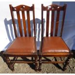 PAIR OF LEATHER PADDED DINING CHAIRS WITH TURNED SUPPORTS