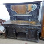 19TH CENTURY CARVED OAK MIRROR BACK SIDEBOARD WITH 4 DRAWERS & 2 PANEL DOORS & FIGURAL DECORATION