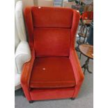 OVERSTUFFED RED COVERED CHAIR Condition Report: The item is in good overall but