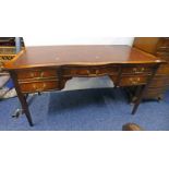 MAHOGANY WRITING TABLE WITH SHAPED LEATHER COVERED TOP CENTRALLY SET DRAWER,