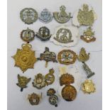 20 CAP BADGES TO INCLUDE THE NORFOLK REGIMENT, EAST SURREY, KINGS OWN SCOTTISH BORDERERS,
