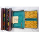 CASED MAH-JONG SET, HOLDERS AND INSTRUCTIONS Condition Report: 144 tiles present.