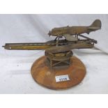 A 20TH CENTURY BRASS MODEL / DESKTOP SEA PLANE LAUNCHER / CATAPULT OF BRASS CONSTRUCTION,