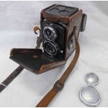 ROLLEIFLEX FRANKE & HEIDECKE TLR CAMERA WITH CARL ZEISS JENA 1:2,8 F-6CM LENSES IN A LEATHER CASE.