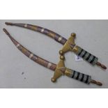 PAIR OF NORTH AFRICAN CURVED DAGGERS.
