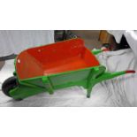 GREEN AND RED PAINTED WHEEL BARROW