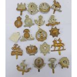 20 CAP BADGES TO INCLUDE ESSEX REGT, WEST RIDING, ROYAL HAMPSHIRE, LANCASHIRE FUSILIERS, THE QUEENS,