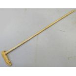 EARLY 20TH CENTURY IVORY WALKING CANE / STICK WITH BAMBOO EFFECT IVORY SHAFT AND A CARVED POUNCING