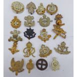 20 CAP BADGES TO INCLUDE THE KINGS OWN, DORSETSHIRE, SUFFOLK REGT.