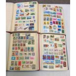 4 STAMP ALBUMS OF VARIOUS MINT AND USED STAMPS OF COUNTRIES BEGINNING A-D TO INCLUDE AUSTRALIA,