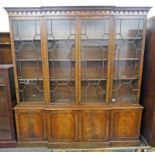 MAHOGANY BREAK FRONT BOOKCASE WITH 4 ASTRAGAL GLASS DOORS OPENING TO SHELVED INTERIOR WITH 4 PANEL