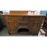 LATE 19TH CENTURY OAK SIDEBOARD WITH 2 FRIEZE DRAWERS OVER CENTRALLY SET CARVED DOOR FLANKED BY 2