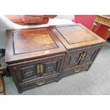 PAIR OF ORIENTAL HARDWOOD BEDSIDE CABINETS WITH 2 PANEL DOORS OVER A DRAWER ON SHAPED SUPPORTS 56CM