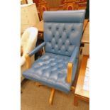 BLUE LEATHER SWIVEL CHAIR Condition Report: Rear has wear to the top left and top