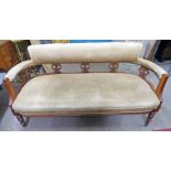 LATE 19TH CENTURY MAHOGANY FRAMED SETTEE WITH DECORATIVE COVERING ON ON TURNED SUPPORTS