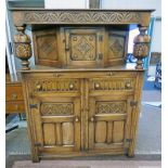 OAK COURT CUPBOARD WITH CARVED DECORATION WITH 2 DRAWERS & 3 PANEL DOORS