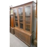 21ST CENTURY 2 PART BOOKCASE WITH 3 GLAZED DOORS OVER DRAWERS & 2 PANEL DOORS