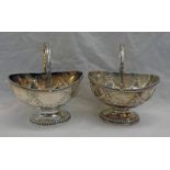 PAIR OF SILVER PEDESTAL SWING HANDLE SWEETMEAT BASKETS, LONDON 1772 WITH EMBOSSED DECORATION,