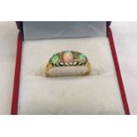 18CT GOLD OPAL & DIAMOND SET RING IN A SCROLL MOUNT Condition Report: Ring size: P.