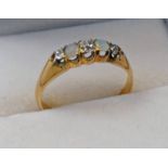 18CT GOLD OPAL & DIAMOND SET RING Condition Report: Ring size: L.