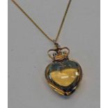 HEART SHAPED PENDANT WITH A 9CT GOLD CORONET MOUNT ON A FINE CHAIN