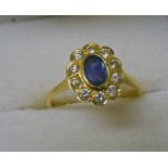 18CT GOLD SAPPHIRE & DIAMOND CLUSTER RING,