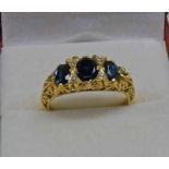 18CT GOLD SAPPHIRE & DIAMOND RING IN A SCROLL MOUNT Condition Report: Ring size: O.