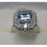 18CT GOLD AQUAMARINE AND DIAMOND CLUSTER RING,