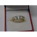 18CT GOLD 5-STONE DIAMOND SET RING IN A SCROLL MOUNT, APPROX. 2.