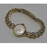 9CT GOLD TISSOT LADIES WRISTWATCH ON A 9CT GOLD BRACELET - 24.