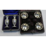 CASED PAIR OF SILVER PEPPERS, BIRMINGHAM 1899 & CASED SET 4 SILVER SALTS,