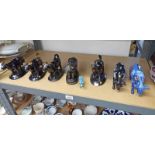 SELECTION OF 19TH CENTURY BLACK AND GILT COW CREAMERS AND OTHERS OVER ONE SHELF