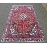 RED GROUND PERSIAN SHAHRUKH CARPET WITH TRADITIONAL SHAHRUKH DESIGN 282 X 175CM