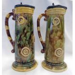 PAIR OF 19TH CENTURY MAJOLICA STYLE GREEN AND YELLOW GLAZED PEWTER LIDDED JUGS - 28CM TALL