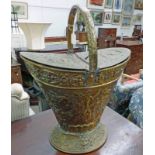 20TH CENTURY BRASS COAL SCUTTLE WITH EMBOSSED FRUIT DECORATION 52 CM TALL