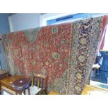 LARGE RED GROUND FLORAL DECORATED MIDDLE EASTERN CARPET 360 X 270 CM Condition Report: