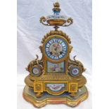 LATE 19TH CENTURY GILT METAL CLOCK WITH DECORATIVE PORCELAIN PANELS ON GILT STAND