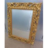 CARVED GILT WOOD FRAMED BEVELLED EDGE MIRROR - OVERALL SIZE 86 X 68 CMS Condition