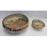 JAPANESE SATSUMA BOWL DECORATED WITH FIGURES CROSSING A BRIDGE,