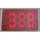 RED GROUND PERSIAN BALUCHI TRIBAL RUG 195 X 112CM Condition Report: Mostly minor