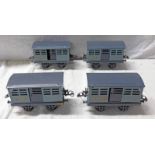 4 HORNBY CATTLE TRUCKS WITH OPEN AXLE GUARDS